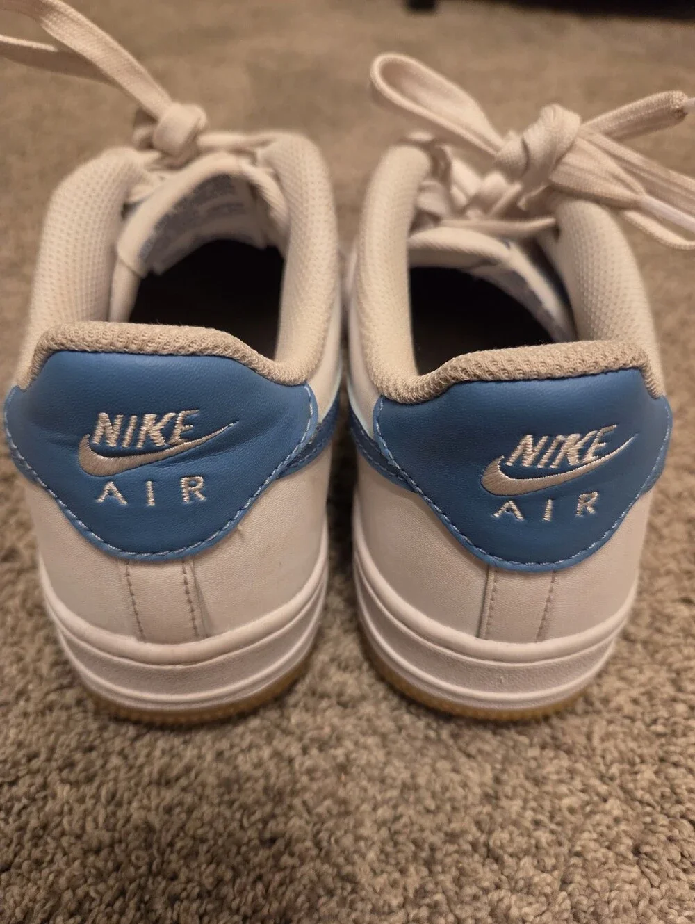 Nike Kids White Sneakers with Blue Swoosh